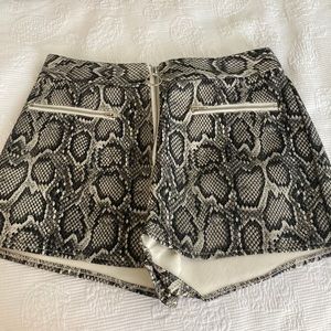 Leather type material snake skin shorts. Size M